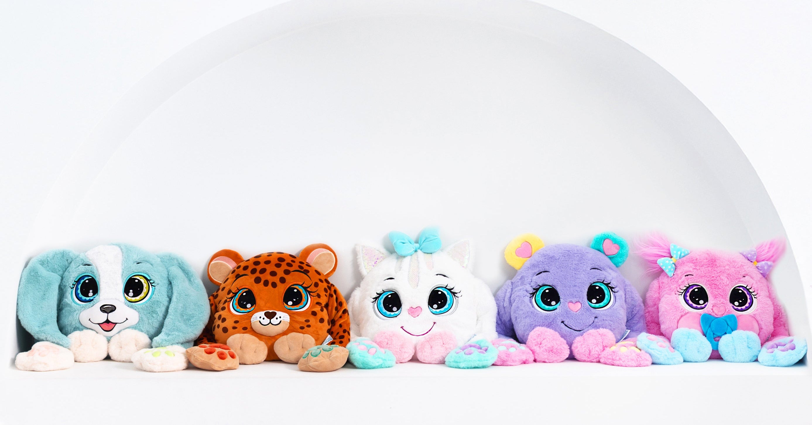 Five weighted colorful plush toys with different animal designs on a white background