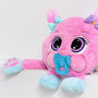 A pink and blue plush weighted toy featuring 3D sensory cheeks, paws, and nose, with large eyes set against a white background.