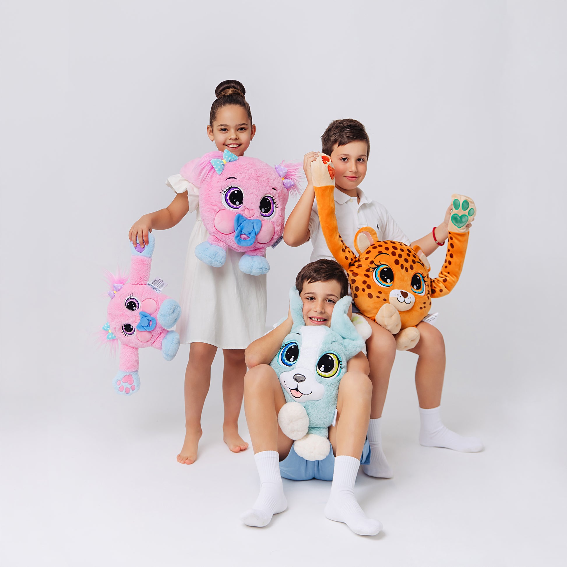 Three kids having fun with a plush weighted leopard ,puppy and baby boo, each with large expressive eyes, 3D sensory cheeks, paws, and nose. These ultra-soft, cuddly sensory plushies provide comfort, relaxation, and stress relief, beautifully displayed on a clean white background.
