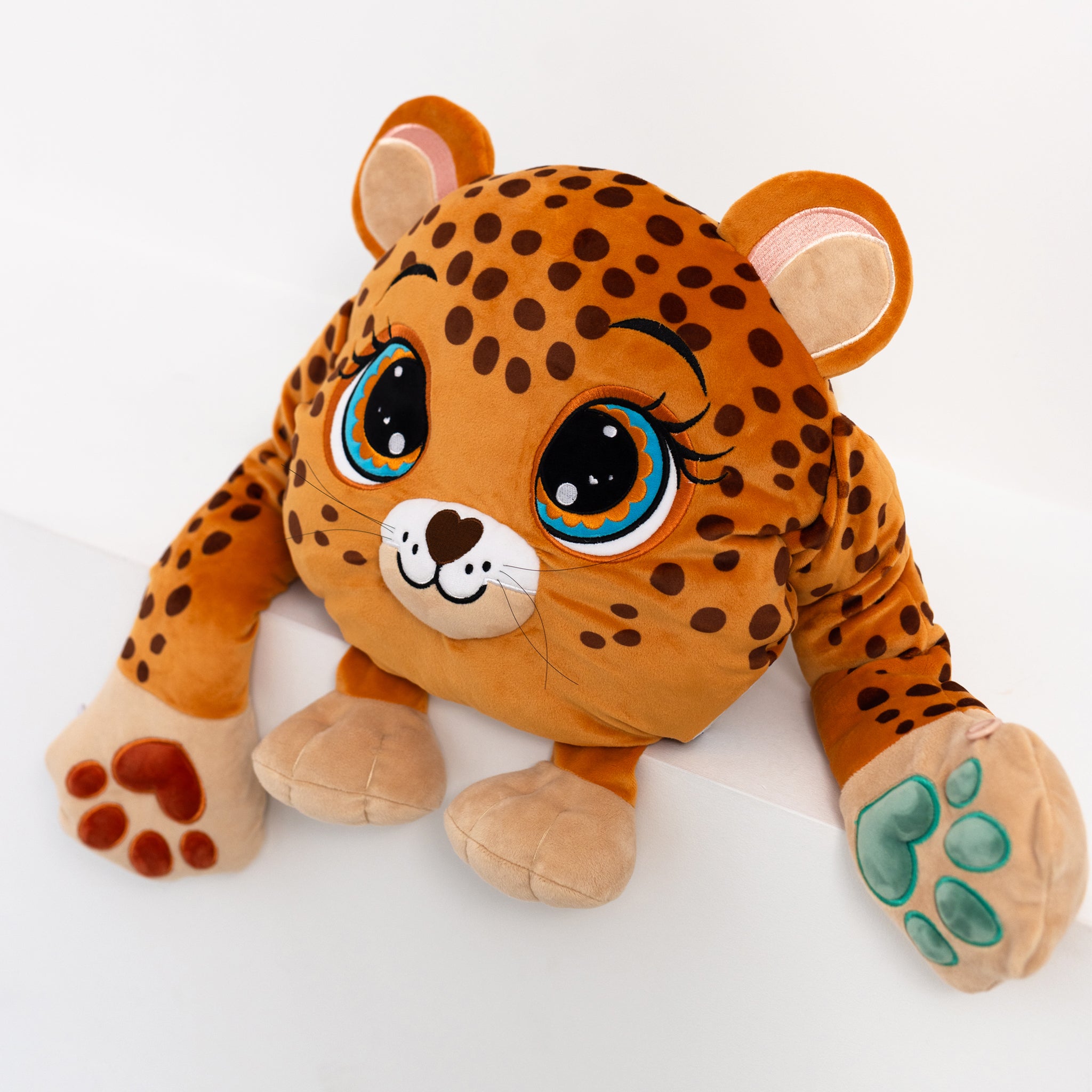 Adorable plush weighted leopard toy with large expressive eyes, 3D sensory cheeks, paws, and nose. This ultra-soft and cuddly sensory plush provides comfort, relaxation, and stress relief — beautifully displayed on a clean white background.