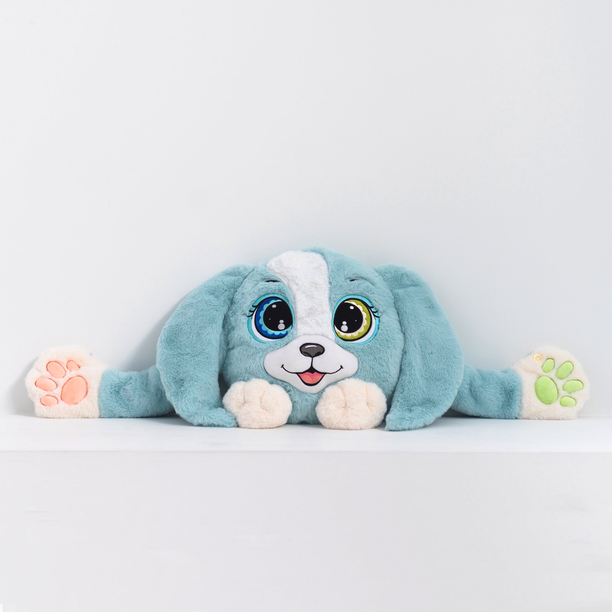 Adorable plush toy dog with blue fur and white accents, featuring large expressive eyes, 3D sensory cheeks, paws, and nose. This ultra-soft, cuddly sensory plush provides comfort, relaxation, and stress relief, beautifully displayed on a light gray background.