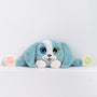Adorable plush toy dog with blue fur and white accents, featuring large expressive eyes, 3D sensory cheeks, paws, and nose. This ultra-soft, cuddly sensory plush provides comfort, relaxation, and stress relief, beautifully displayed on a light gray background.