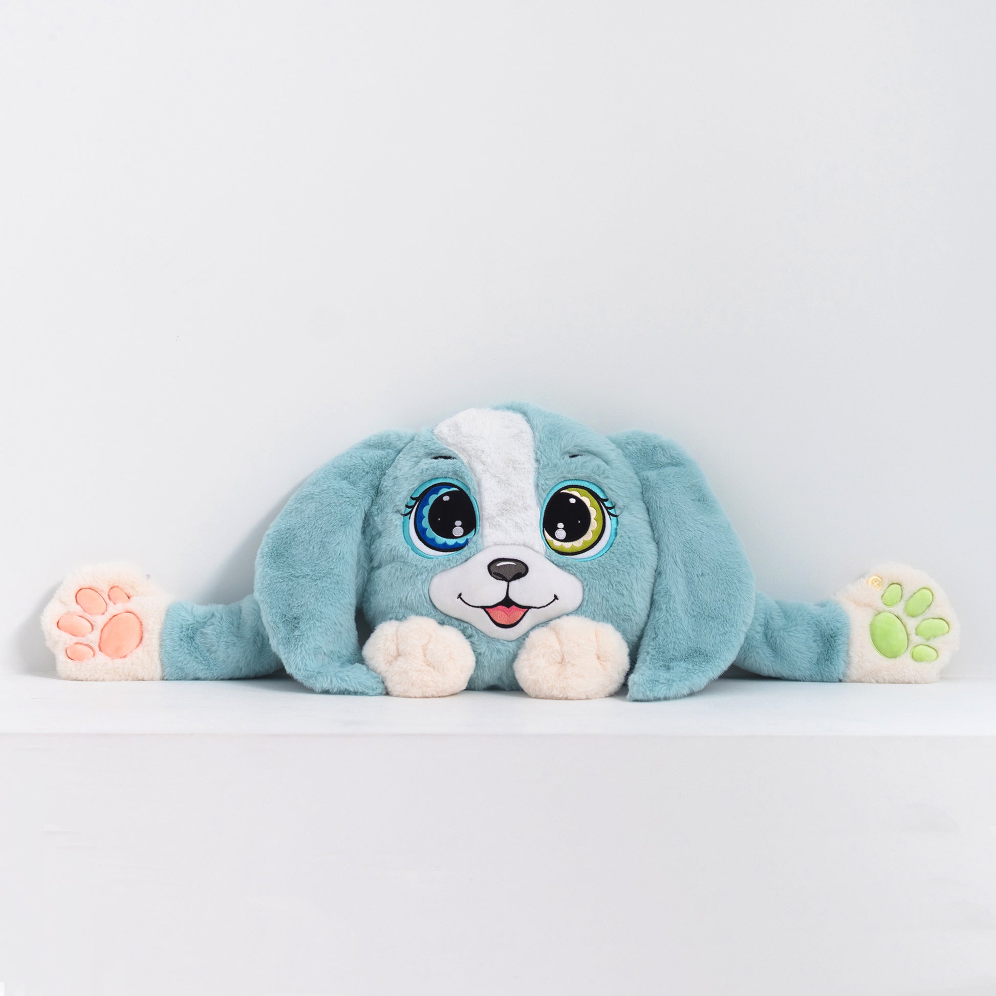 Adorable plush toy dog with blue fur and white accents, featuring large expressive eyes, 3D sensory cheeks, paws, and nose. This ultra-soft, cuddly sensory plush provides comfort, relaxation, and stress relief, beautifully displayed on a light gray background.