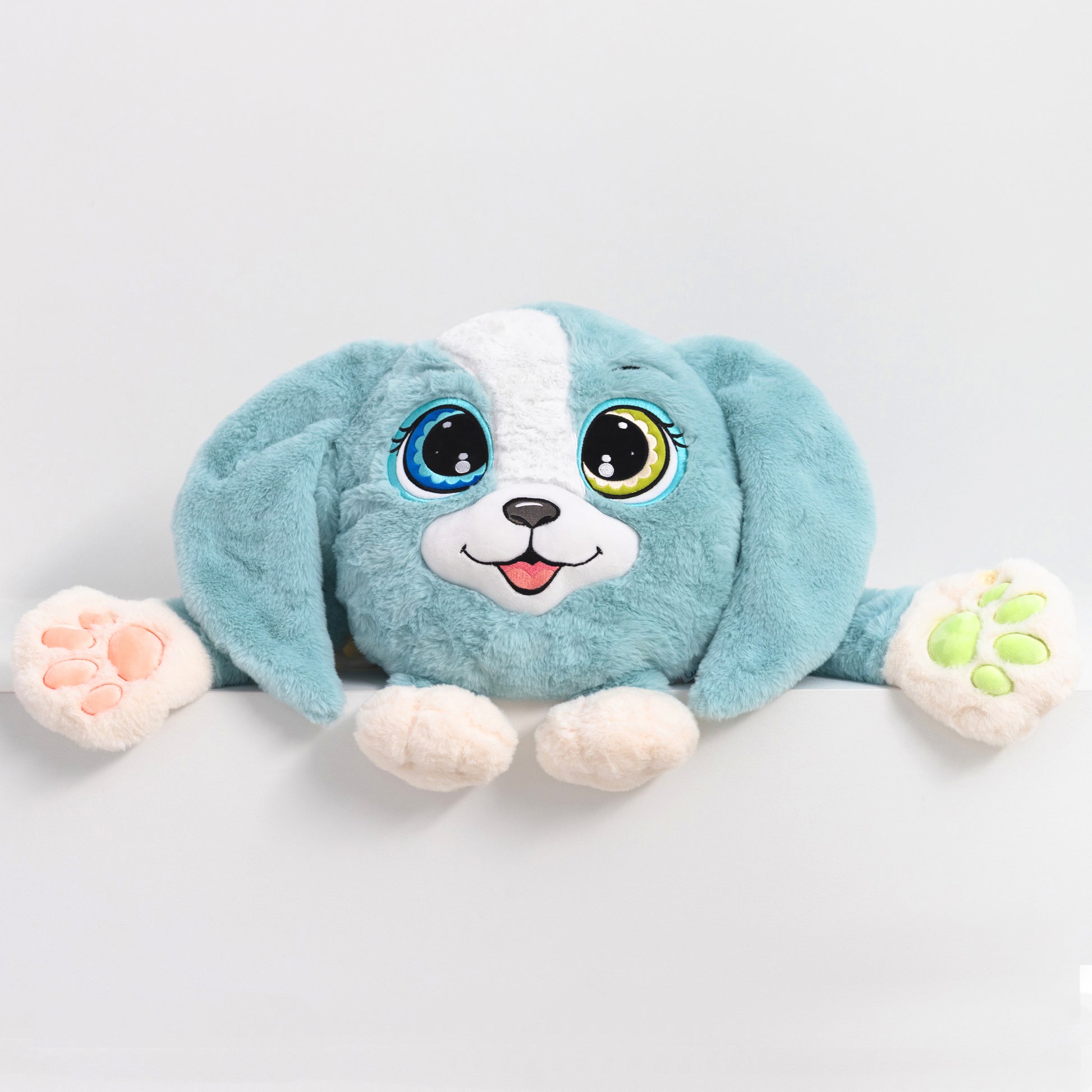 Adorable plush toy dog with blue fur and white accents, featuring large expressive eyes, 3D sensory cheeks, paws, and nose. This ultra-soft, cuddly sensory plush provides comfort, relaxation, and stress relief, beautifully displayed on a light gray background.