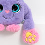 Purple plush weighted toy featuring 3D sensory cheeks, paws, and nose, with pink paws, blue accents, and large expressive eyes. This soft, cuddly sensory plush is perfect for relaxation, stress relief, and comfort, displayed on a clean white background.